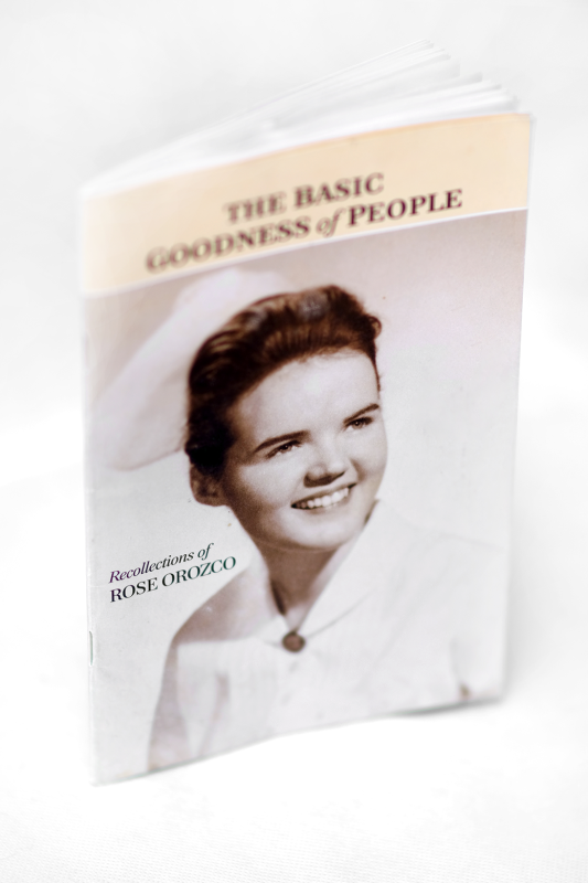 A book cover with a black and white portrait of a woman smiling.